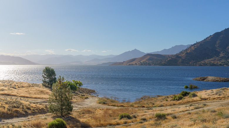 A big lake sits under the mountains in Kern County, California