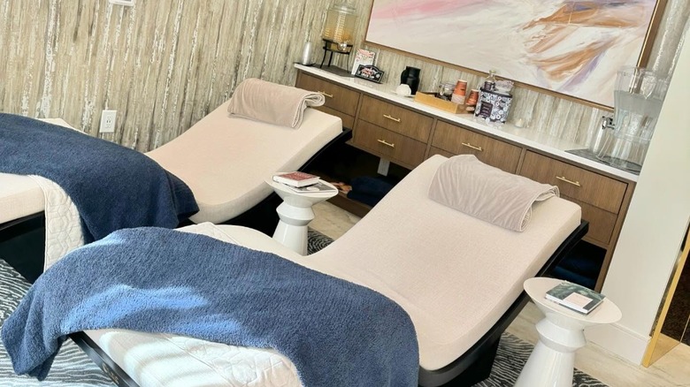 Two relaxing chairs overlook beautiful gardens in the waiting room at Spa Hartness.