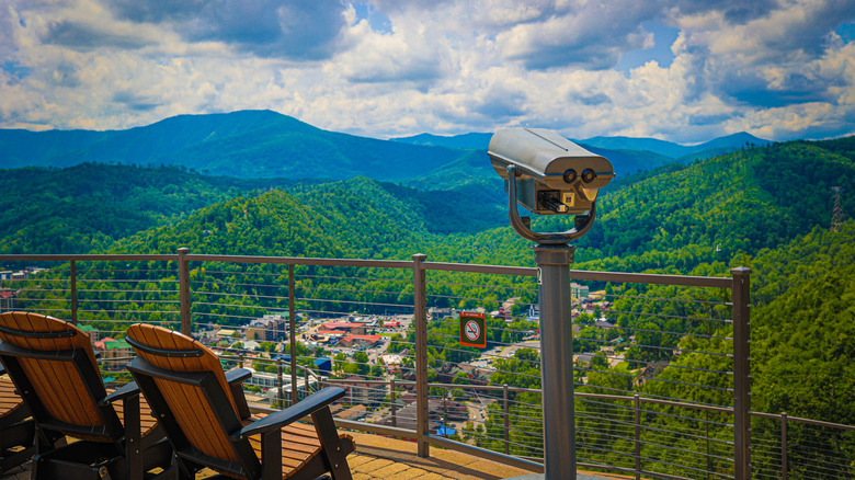 A coin-operated telescope on a viewing platform overlooking Gatlinburg, Tennessee