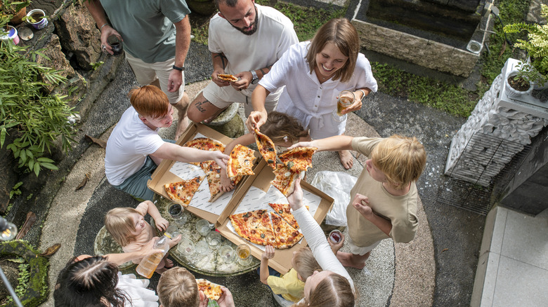 A group of foodies enjoying pizza