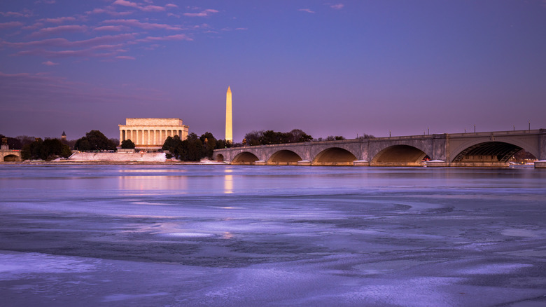 The Arlington Memorial Bridge and the National Mall during twilight on an icy winter day.