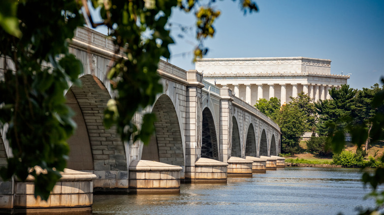 The Arlington Memorial Bridge stretches across the Potomac River towards the Lincoln Memorial.