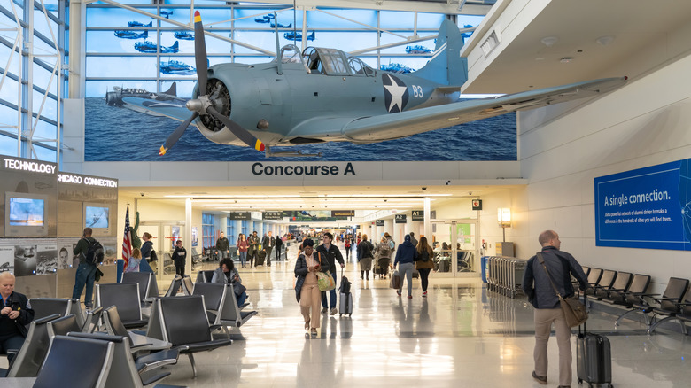 Chicago Midway International Airport with bomber plane and concourse A