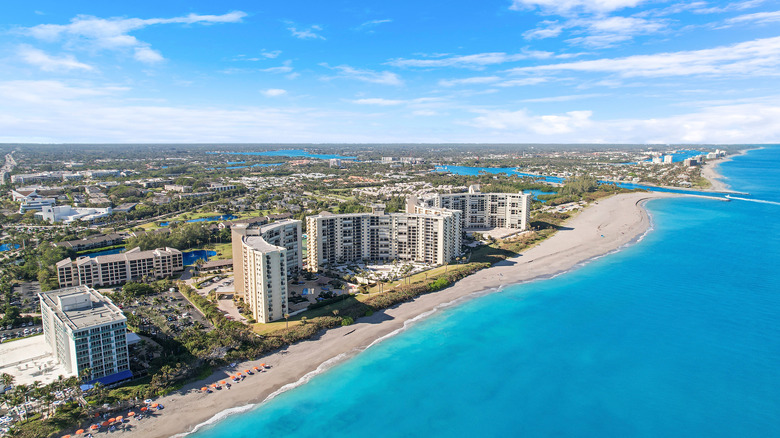 Aerial view of Jupiter Beach coastline and apartment complexes