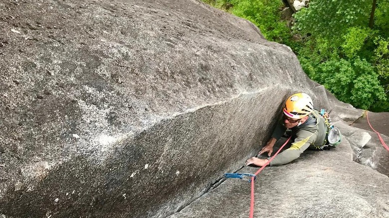 climber attached to rope on wall