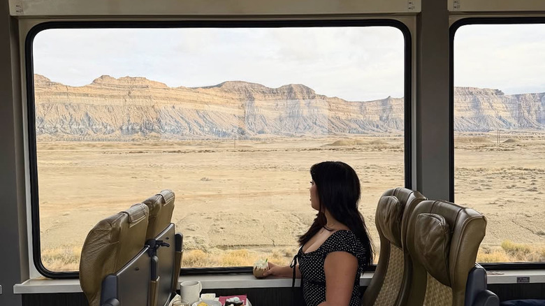 A woman rides the Rockies to the Red Rocks train