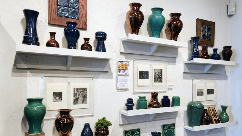 Displays of pottery on wall shelves in Pewabic Pottery, Detroit
