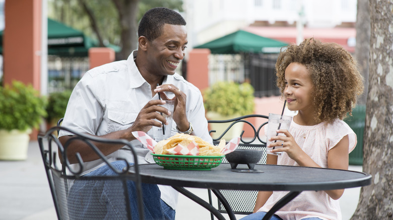 A father and daughter dining out in Orlando, Florida