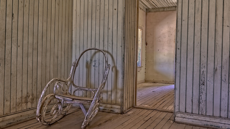 Rocking chair positioned at the side of a doorway