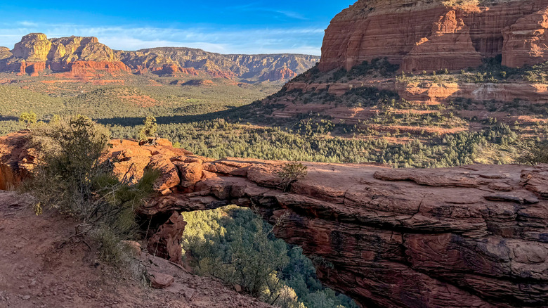 Devil's Bridge in Sedona, Arizona, against more red rock mountains