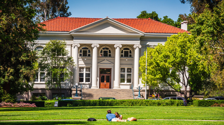 Students lying on the grass in front of library, Claremont Colleges