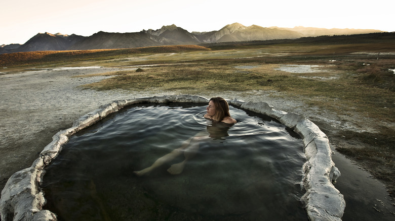 A woman relaxing in a hot spring in California