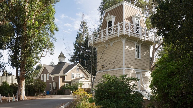 Victorian water tower surrounded by mature trees and lawns in Holbrook-Palmer Park, Atherton