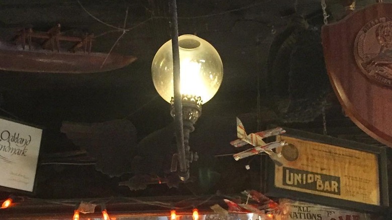One of the antique gas lamps that are in Heinold's First and Last Chance Saloon