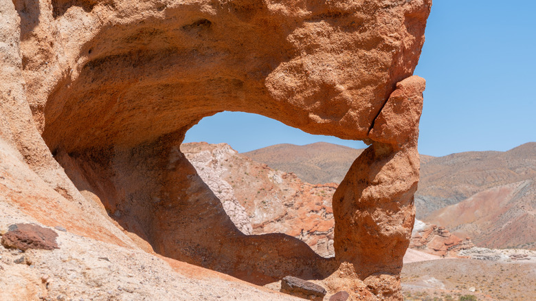 "The Window" rock formation against the sandstone cliffs in Red Rock Canyon State Park, California