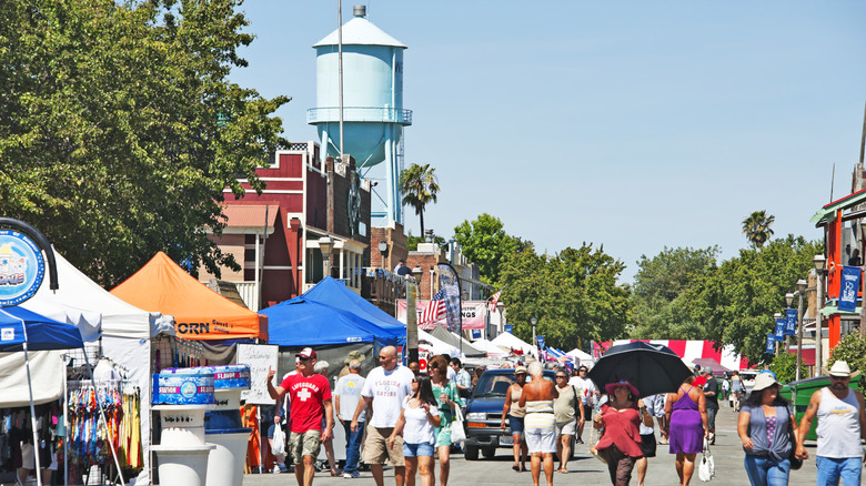 People at a festival in Isleton, California on a sunny day