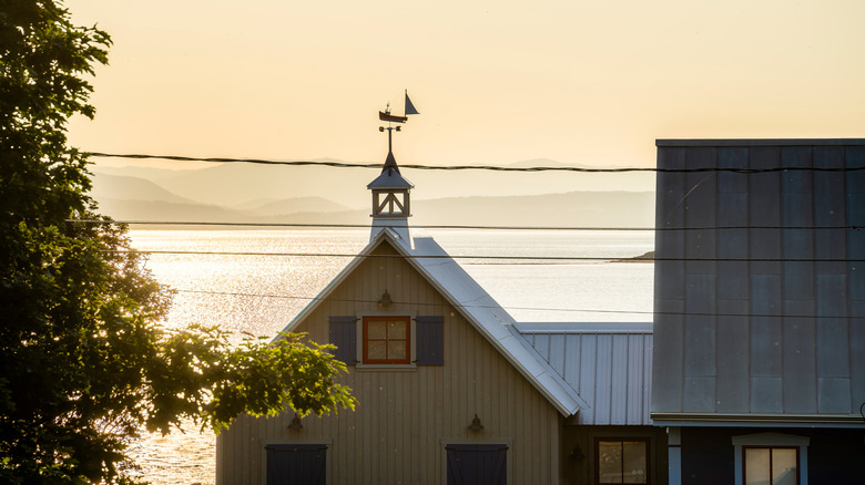 Ther gabled roof of a house by the river in Kamouraska, Canada