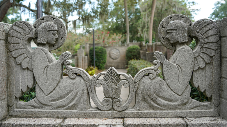 Concrete artwork of angels facing each other