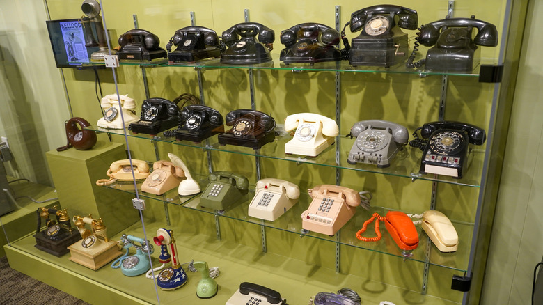 Telephones sitting on shelves