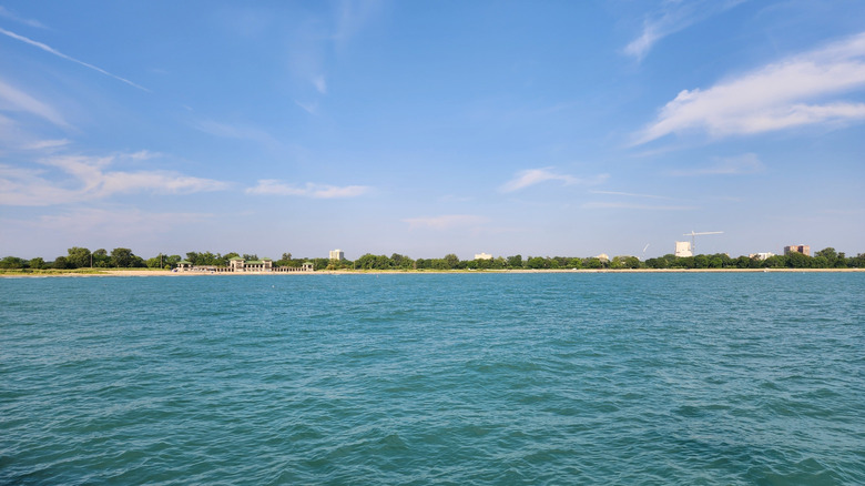 A view of 63rd Street Beach in Chicago, with blue water and sky