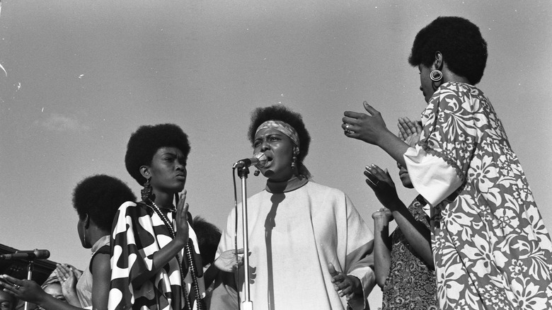 A vintage photo of singers performing with Phil Jackson at 63rd Street Beach