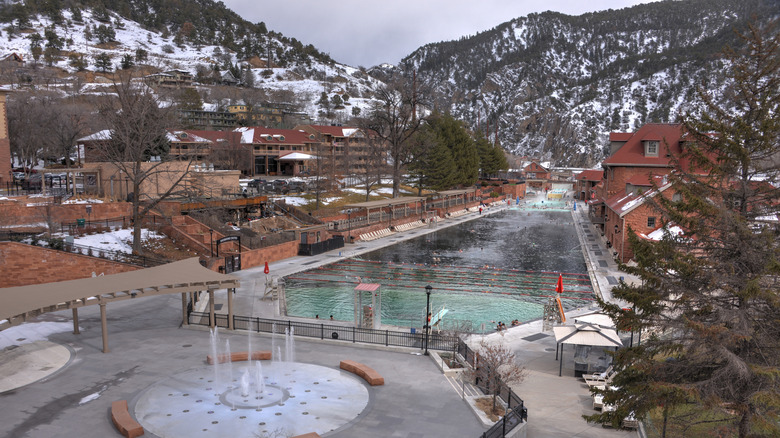 Glenwood Hot Springs Pool in the winter with snowy mountains