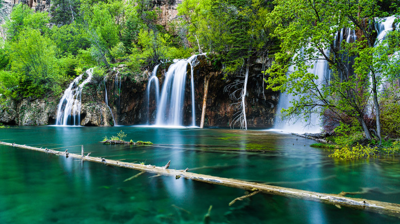 A waterfall cascading into water at Hanging Lake, in Colorado.