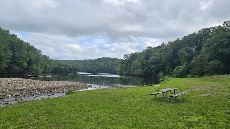 Lake Zoar from Kettletown State Park in Connecticut with a gray sky and green forest nearby