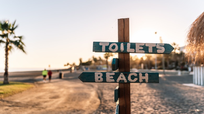 Sign for restrooms at the beach