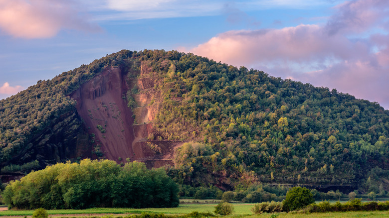 The partially mined Croscat Volcano of La Garrotxa at sunset