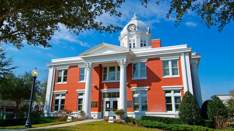 Historic Dade City, Florida, courthouse with blue sky and green lawn