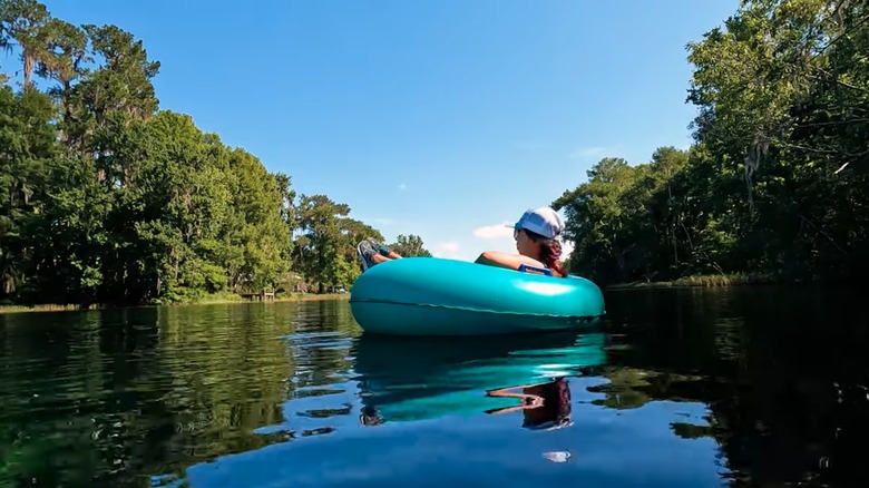 Woman tubing on a river