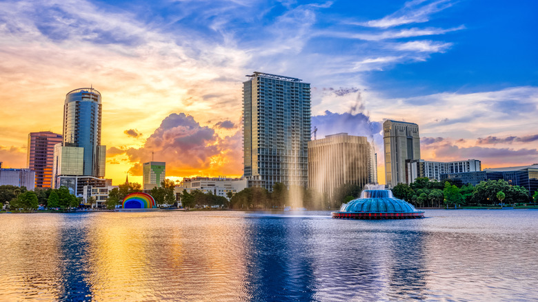 Sunset over Lake Eola Park with the fountain, amphitheater, and buildings in the background