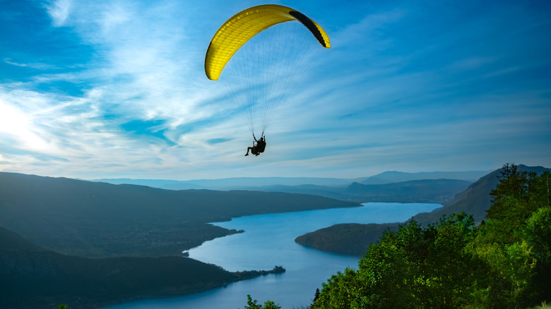 Paraglider hovering over Lake Annecy