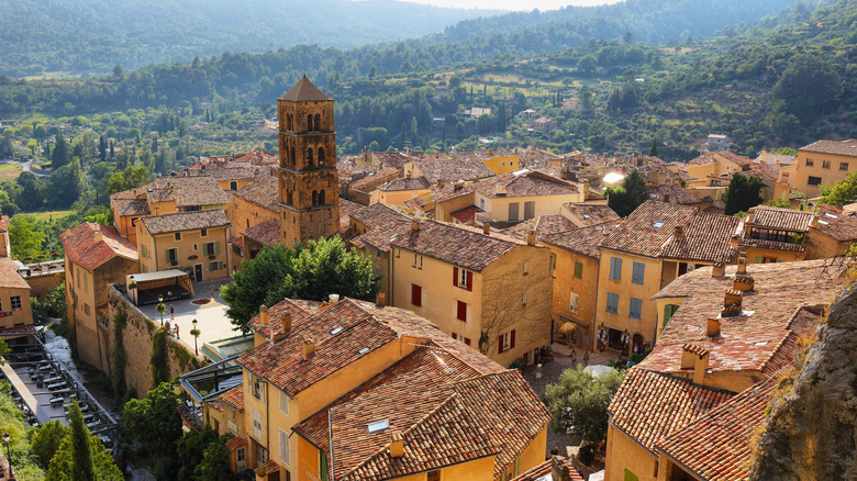 Aerial view of Moustiers-Sainte-Marie, France, surrounded by lush landscape