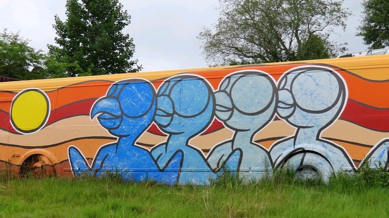 Bird mural on an old school bus
