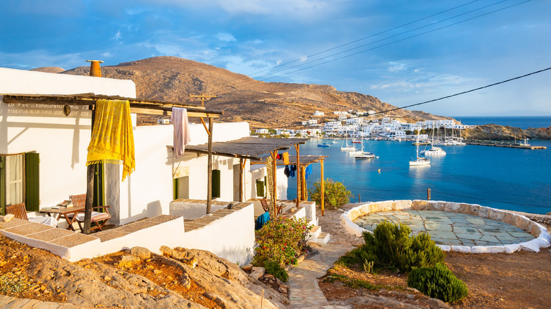 Traditional style Greek apartments at sunrise in Karavostasis port, Folegandros island,