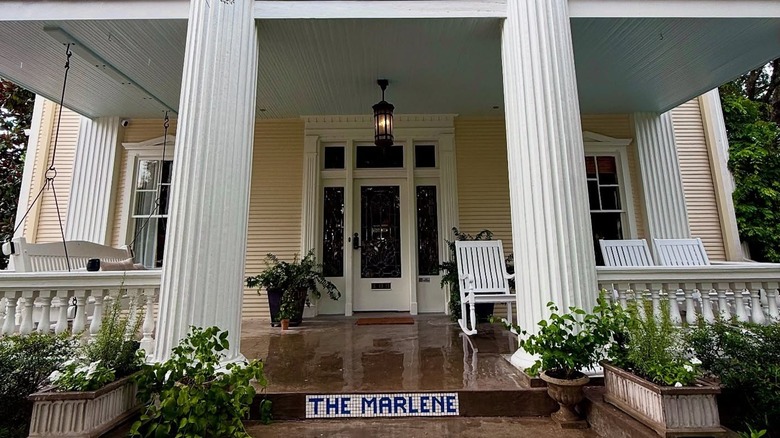 The entrance to The Marlene Inn with its oversized porch on a rainy day