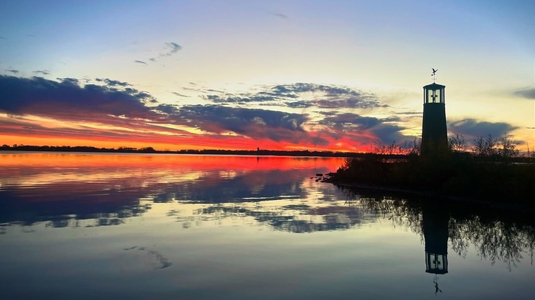 Storm Lake at sunset with lighthouse in the background