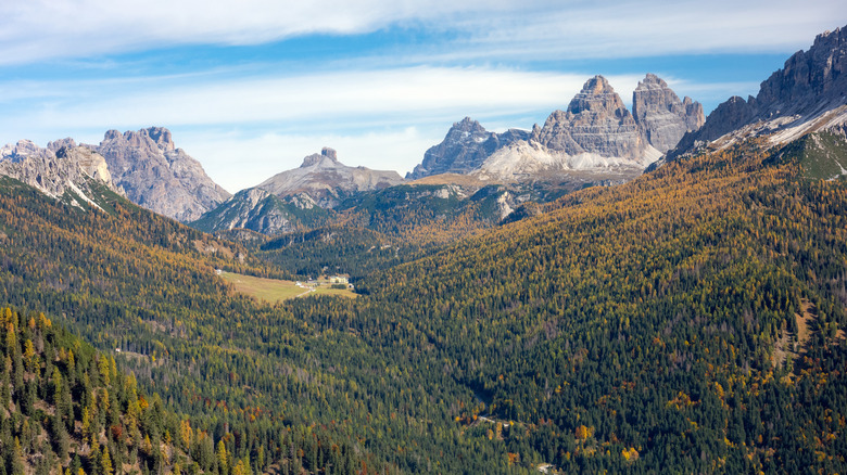 Wooded valleys and rocky peaks surround Lago di Sorapis