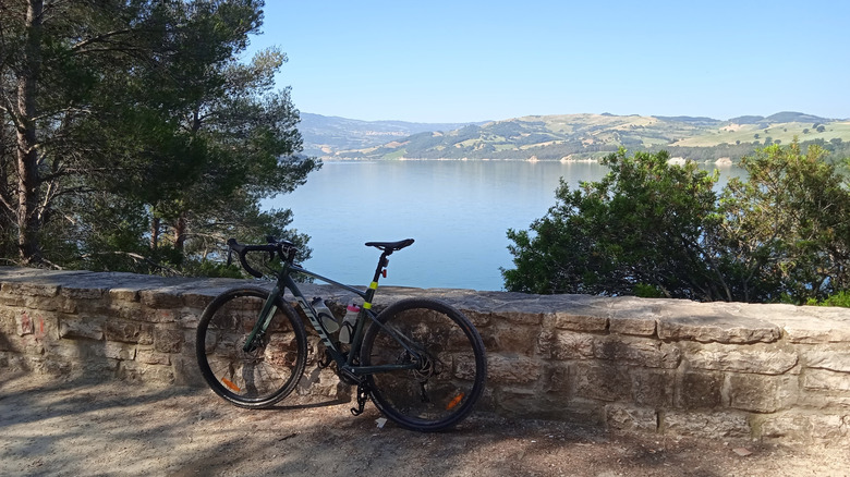 Bicycle stationed on a path overlooking Lago di Occhito in Italy