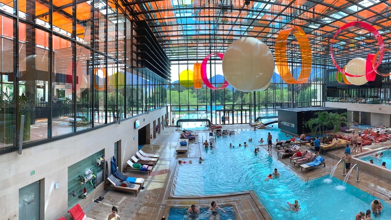 Swimmers at indoor pool complex.