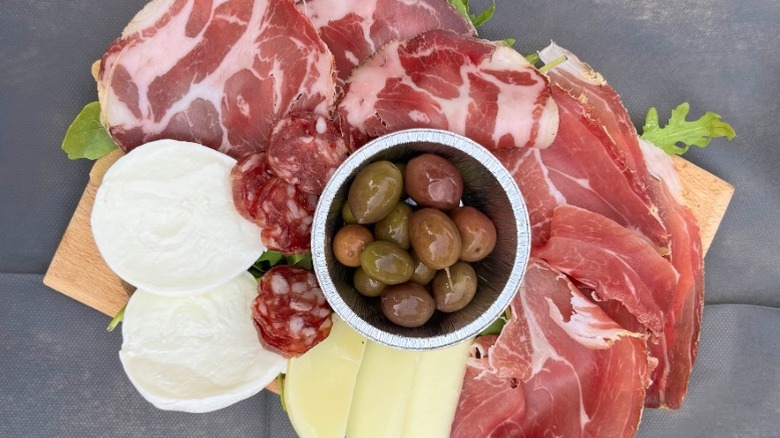 Local proscuitto, salami, olives, and cheeses at Piazza del Popolo, Sermoneta, Italy
