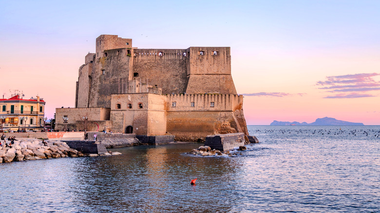 Castel dell'Ovo on the coast of Naples, Italy, at sunrise