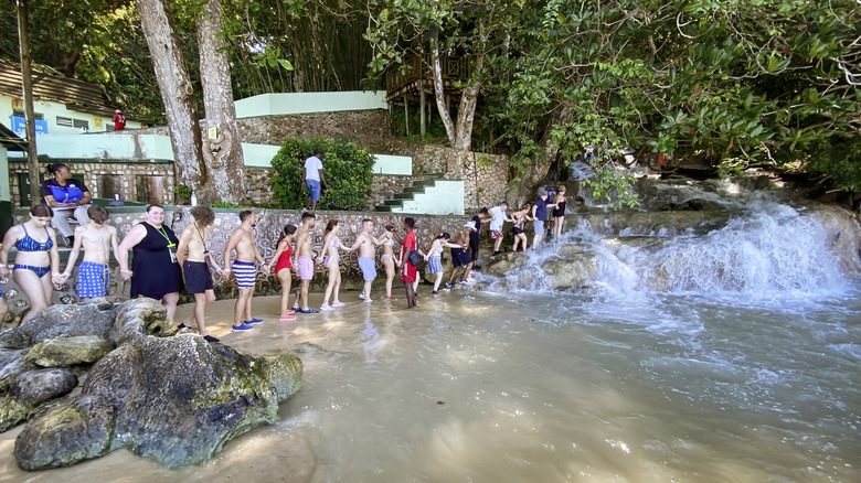 A group of people climbing Dunn's River Falls