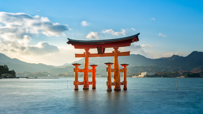 Orange torii gate of Itsukushima Shrine in Miyajima, Japan
