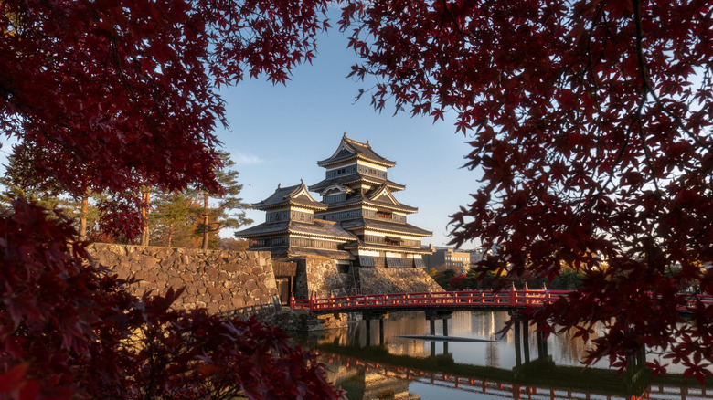 Matsmoto Castle in Nagano Prefecture, Japan, with autumn leaves