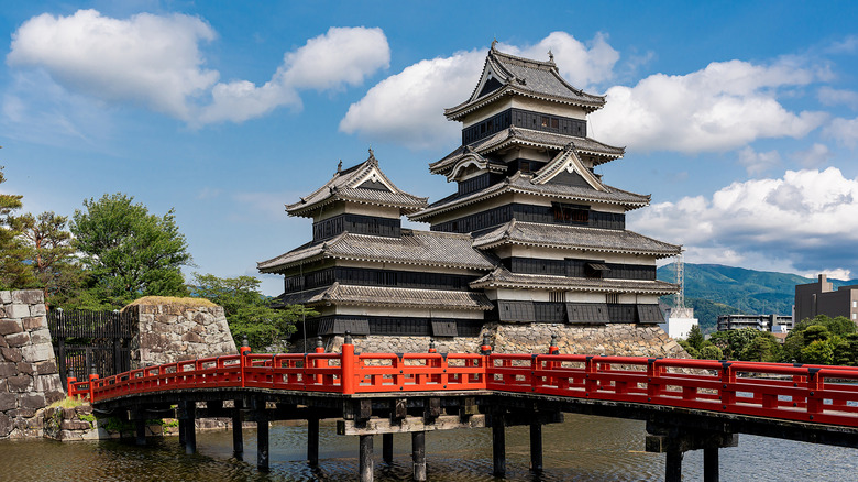 vermilion bridge across the moat at Matsumoto Castle