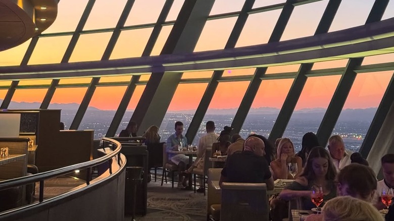 Diners enjoy their meals at the fine dining restaurant at the top of the tower at The Strat