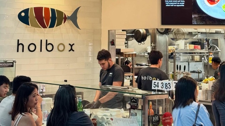 customers sit at counter at Holbox restaurant